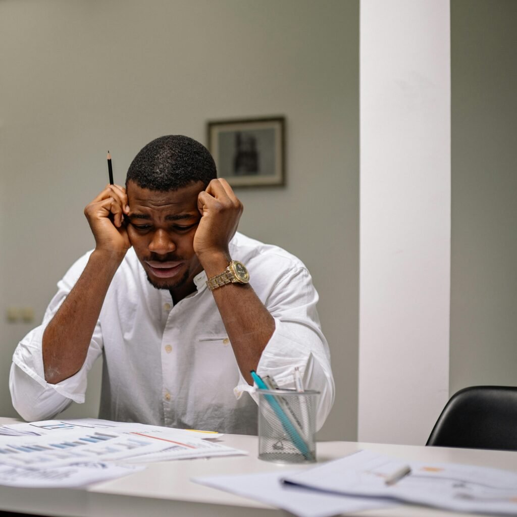 Stressed out couple looking at renovation plans